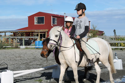Pony-Lessons-2-children-in-arena